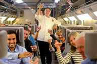 European rail service Eurostar began its 20th anniversary celebrations yesterday (9 October) by setting the World Record for the largest Champagne tasting event. The stunt was attended by TV chef Raymond Blanc, who is Eurostar's business premier culinary director. He and his sommelier from restaurant Belmond Le Manoir aux Quat'Saisons, Arnaud Goubet, joined passengers on the 10:25am service from London St Pancras to set the record. Travellers in all classes were served three types of Champagne to sample and a slice of Opera cake. An official Guinness World Records adjudicator announced that the record had been broken, with a total of 515 travellers taking part