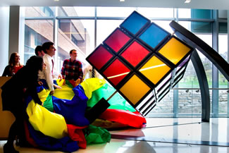 A giant Rubik's Cube newly installed on the University of Michigan's North Campus is the world's largest hand-solvable, stationary version of the famous puzzle. The 1,500-pound, mostly aluminum apparatus was unveiled on the southwest corner of the second floor of the G.G. Brown Building. It was imagined, designed and built by two teams of mechanical engineering undergraduate students over the course of three years. 