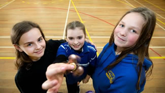  Penny Hambling, Tessa Georgeson and Jade Hassall, all 12, with their fidget spinners following Bell Block Primary School student council's attempt to set a world record for the most people spinning the gadgets in one place for 30 seconds.