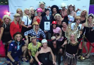 Sporting the many looks of Madonna, organizers of the 19th annual Fool's Paradise Drag Party in Fire Island Pines pose with an adjudicator from Guinness World Records on Saturday, Aug. 30, 2014, after setting the record for "Largest Gathering of People Dressed as Madonna." Photo Credit: The Fool's Paradise Drag Party.