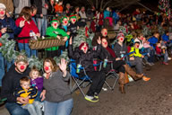 In attempt to break a Guinness World records' world record, the city of Gatlinburg, Tennessee distributed 20,000 red Rudolph noses to parade goers during the 39th Fantasy of Lights Christmas Parade. More than 70,000 people lined the Parkway to witness the event and catch a glimpse of Grand Marshal and 2014 American Idol winner, Caleb Johnson.