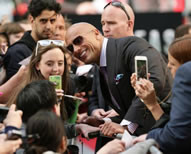 - Dwayne Johnson, aka The Rock, smashed the selfie Guinness World Records world record; the 43-year-old star took to the red carpet in London's Leicester Square with co-stars Kylie Minogue, Alexandra Daddario and Carla Gugino and director Brad Peyton; before the screening of the disaster drama, the Fast And Furious actor posed for selfies with 105 fans, setting the new world record for the Most selfies taken in three minutes.