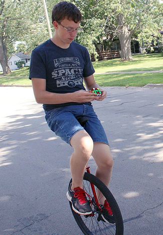 Most Rubik's Cubes solved while riding a unicycle: Stuart Sobeske breaks Guinness  World Records record (VIDEO)
